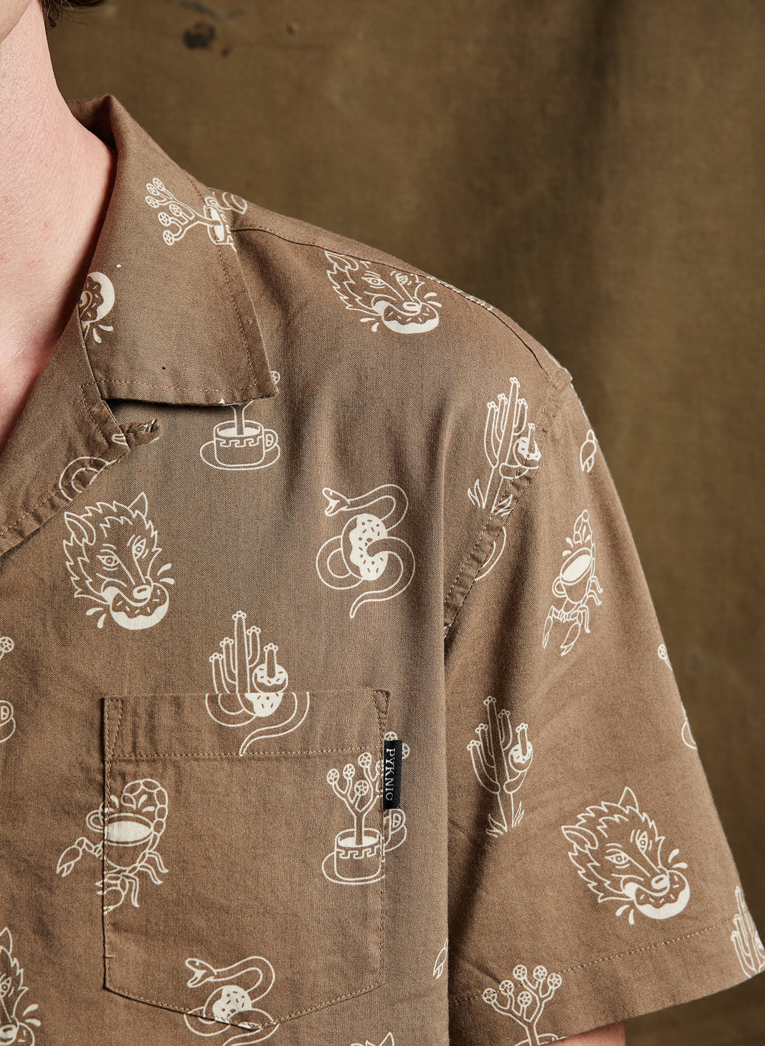 men - Pyknic | Desert Donuts Vacation Casual Button-Up Shirt | Button Down Shirt with All Over Graphic Print, Doughnuts and Coffee Shirt, Cool Food Shirt, Best Foodie Shirt, Best Foodie Gift, Food Themed Apparel, Food Tattoo Flash, Snake Cactus Wolf and Scorpion Pattern Button Down Shirt, Cool Button Up Shirts, Alternative Lifestyle Brand, Motorcycle Lifestyle Brand, Breakfast Button Up Shirt, Pastry Baker Shirt, Bakery Shirt