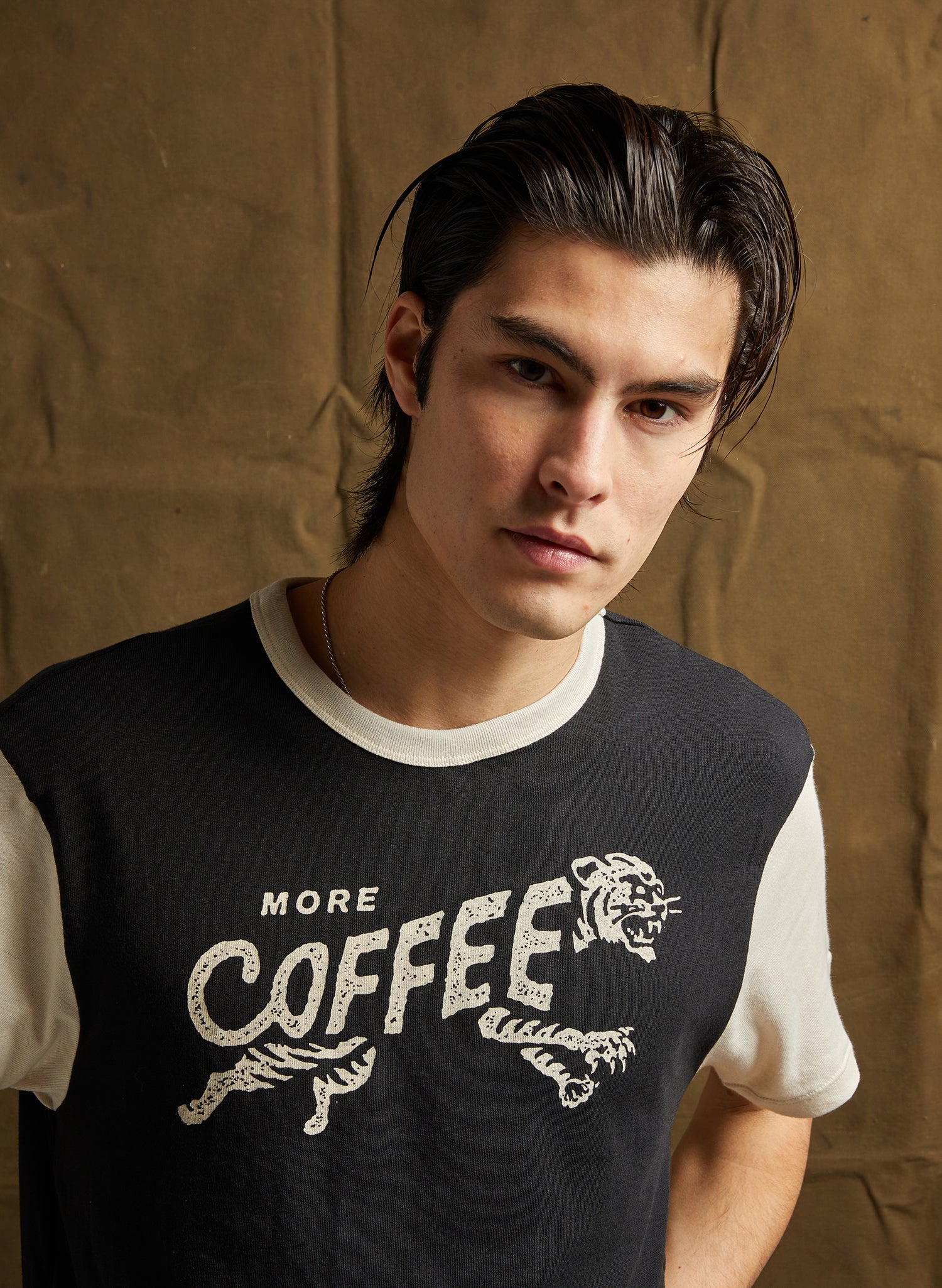 More Coffee Graphic Tee with bold vintage text and tiger screen print.